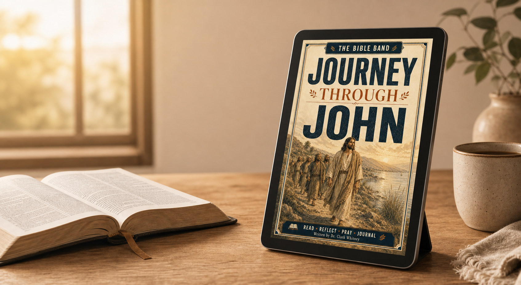 Journey Through John devotional displayed beside an open Bible